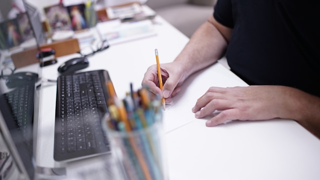 A designer sketching on a table