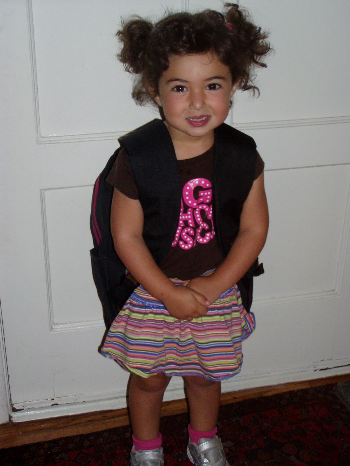 Sophie Hankin as a young girl with pigtails