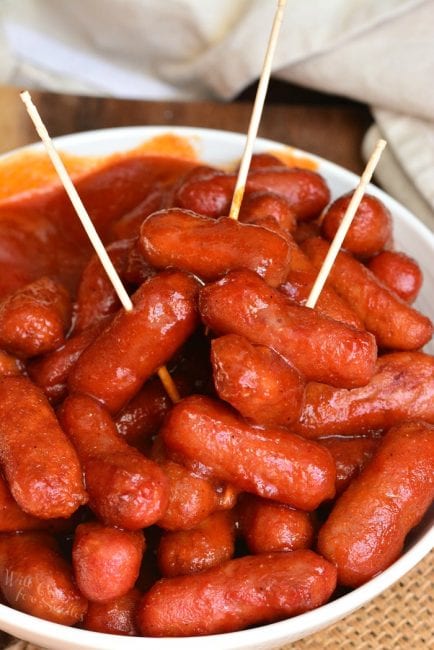 closeup of little smokies in BBQ sauce and toothpicks