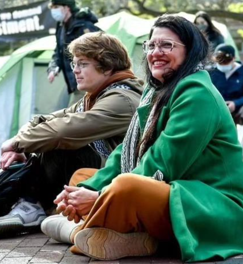 Rashida sits with student protestors