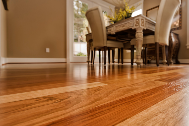 hardwood vs luxury vinyl flooring comparing interior upgrades dining room floor with table and chairs custom built michigan