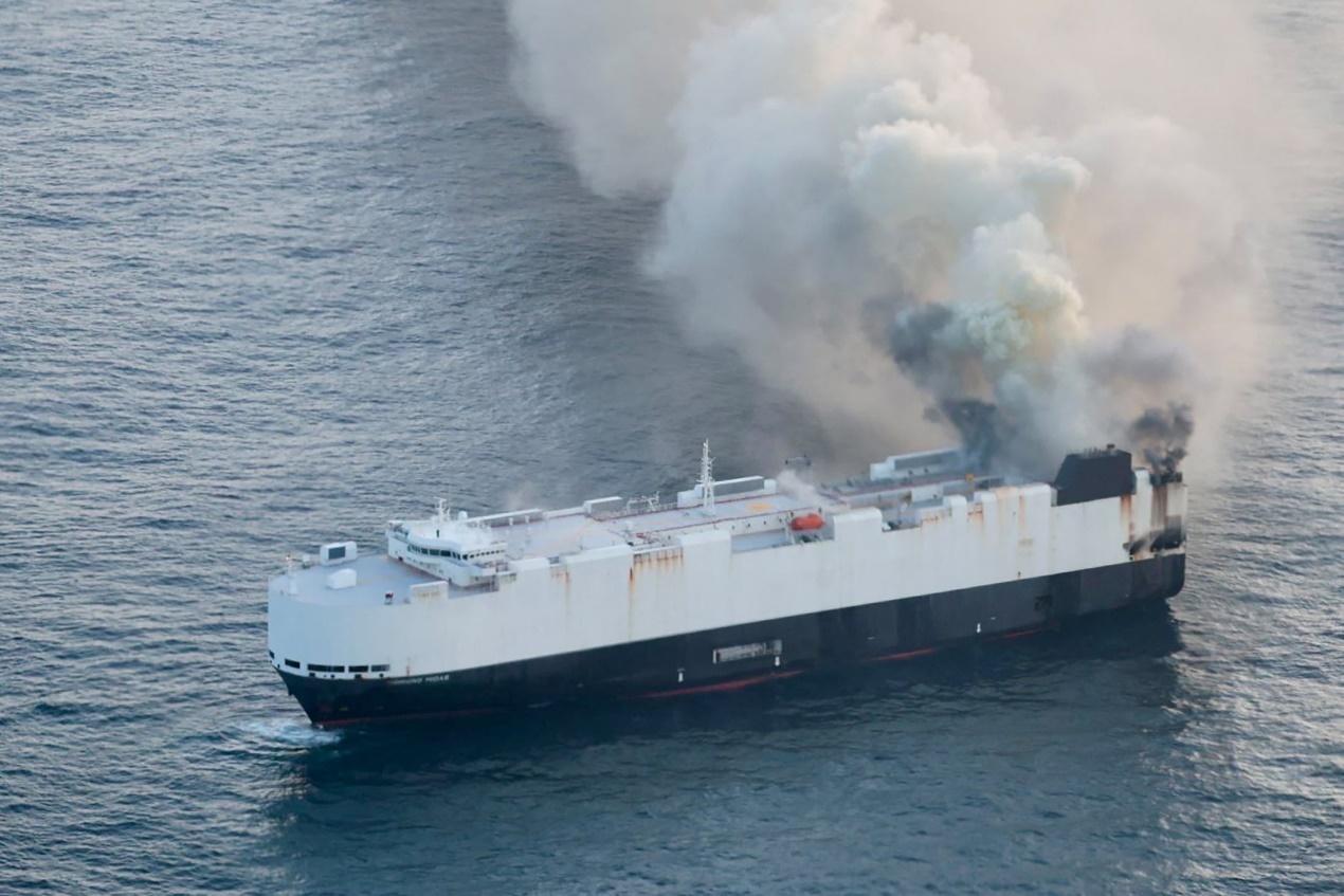 Smoke rises from a fire aboard the cargo vessel Morning Midas, carrying around 3,000 vehicles, including 800 electric vehicles, as seen in an aerial photograph taken from a U.S. Coast Guard C-130J Super Hercules, approximately 300 miles south of Adak, Alaska, U.S. June 3, 2025. U.S. Coast Guard/Air Station Kodiak/Handout via REUTERS. THIS IMAGE HAS BEEN SUPPLIED BY A THIRD PARTY