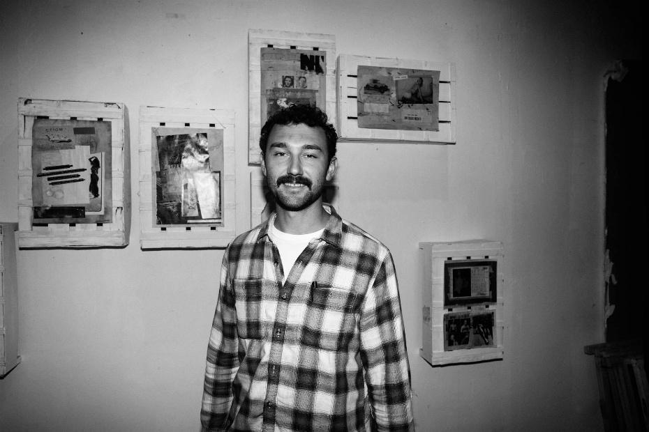 A person standing in front of a wall with pictures on it

AI-generated content may be incorrect.