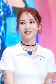 A picture of Byul on a white polo, and she is smiling