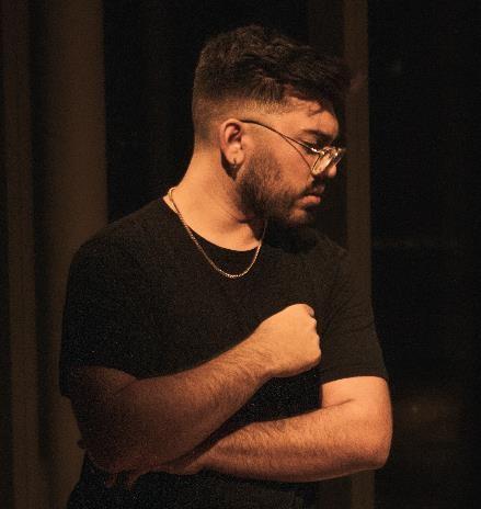 A person with glasses and a beard  AI-generated content may be incorrect.