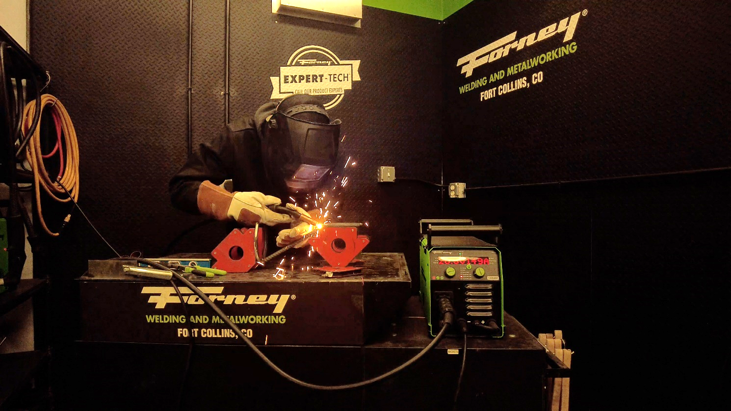 A person welding a piece of metal

Description automatically generated with medium confidence