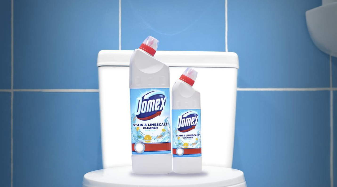 A bottle of toilet cleaner on a toilet

Description automatically generated