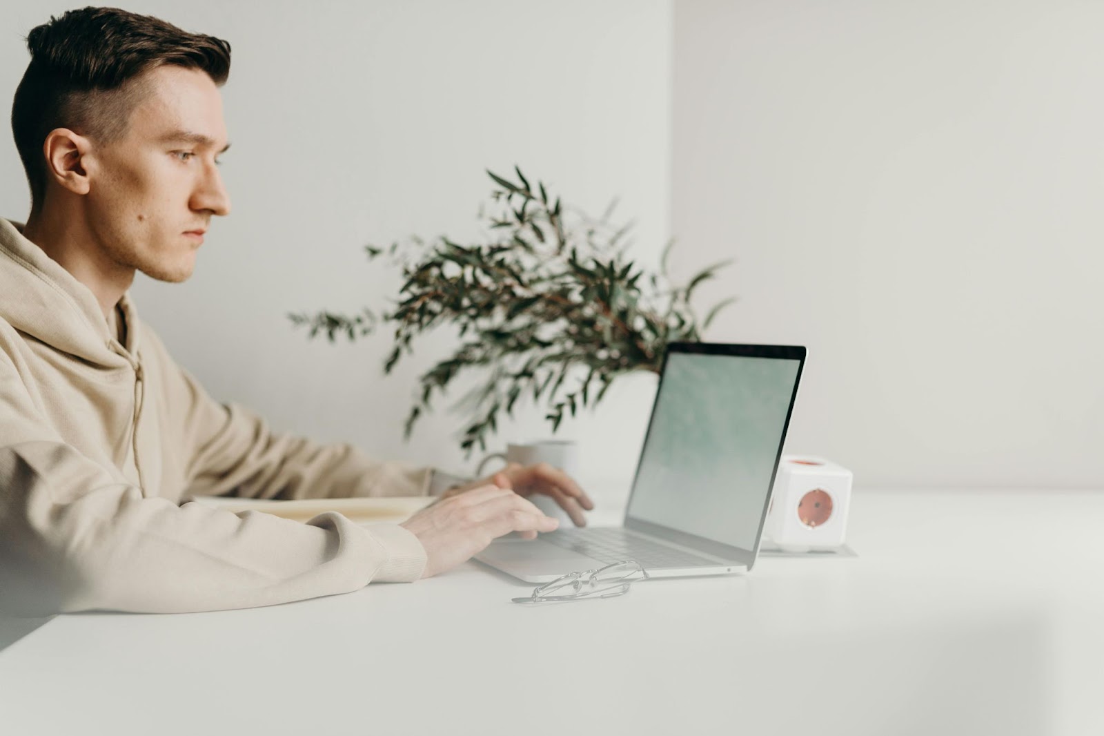 image of a man using a laptop