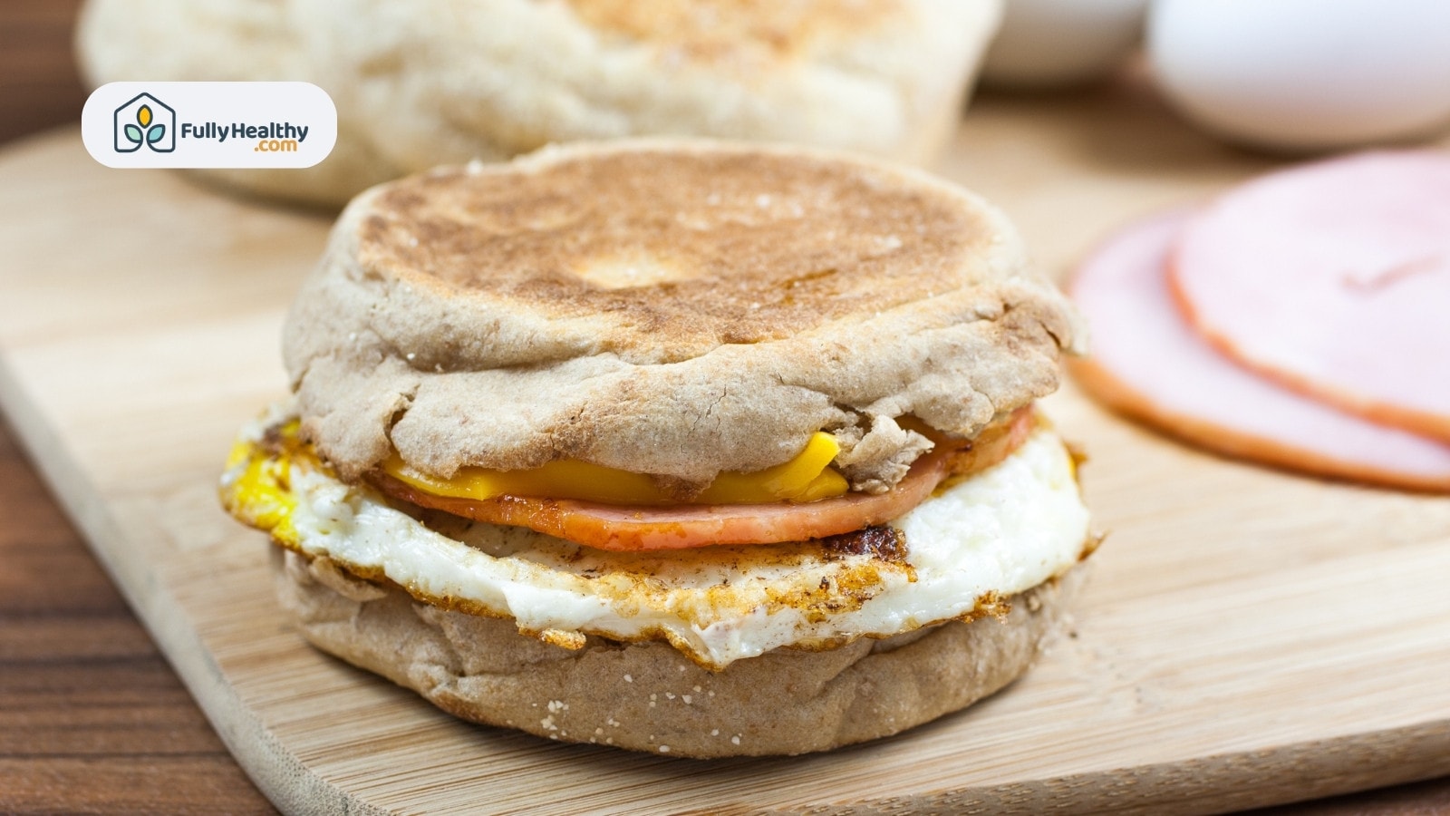 Egg ham and cheese sandwich on whole grain English muffin