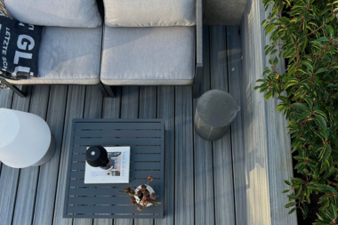 benefits of hiring a trexpro platinum installer for your deck build aerial view of composite decking living area with outdoor furniture custom built michigan