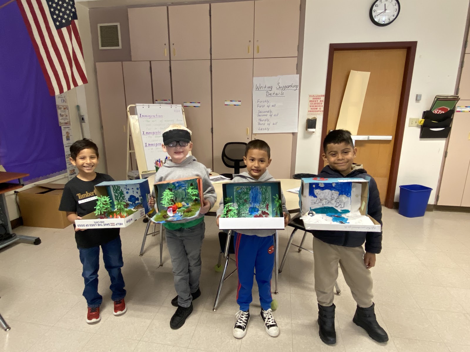Students with their 3D dioramas of various habitats
