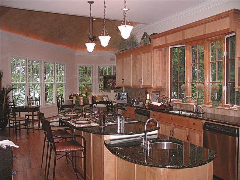 Surrounding windows flood the kitchen with natural light.