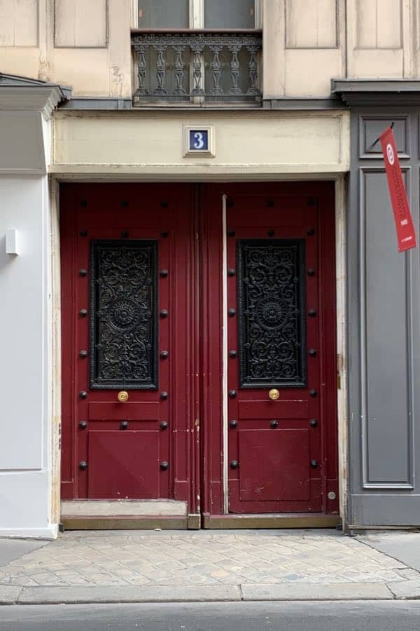 Red front door painted with Benjamin Moore Caliente