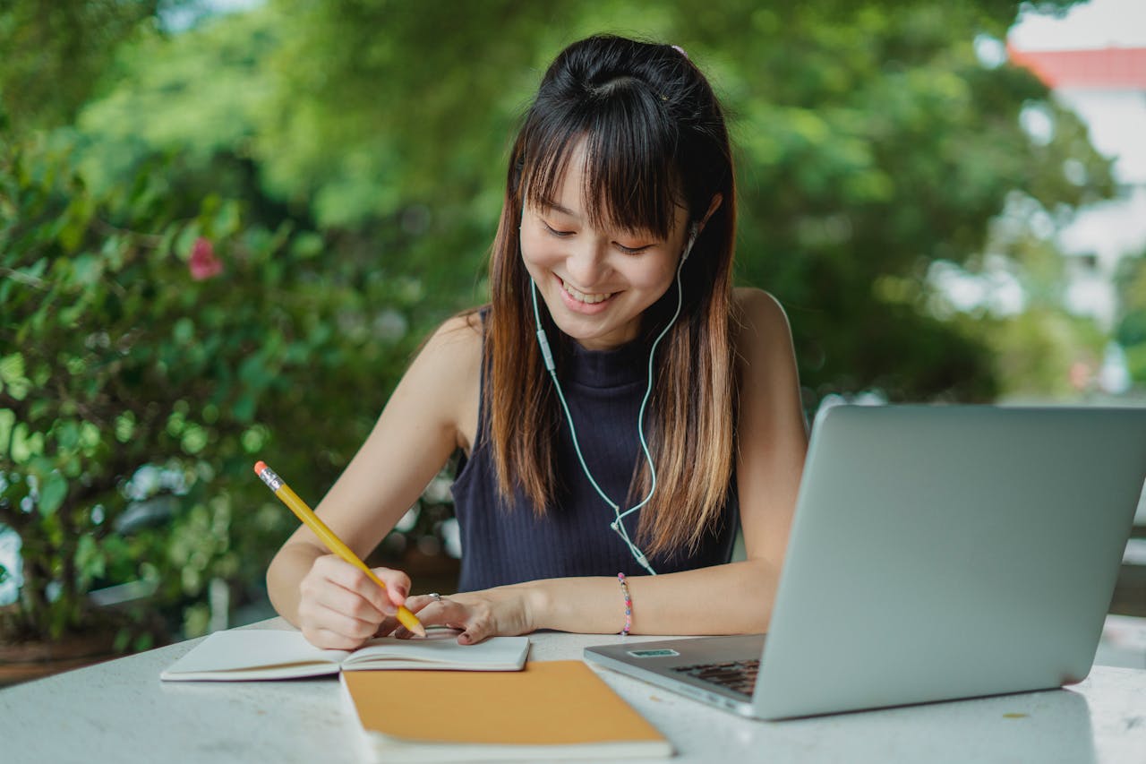 A woman writing an essay using AI Essay Writing Tools