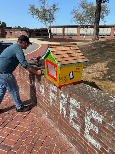 image of Mr. Ventura building the outdoor free library at FES