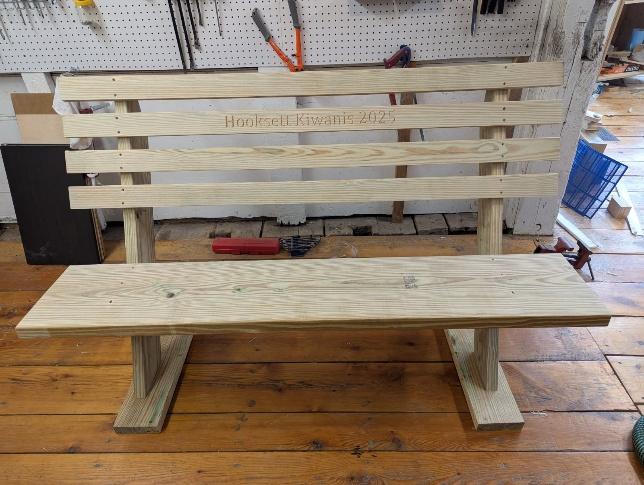 A wooden bench on a wood floor

AI-generated content may be incorrect.