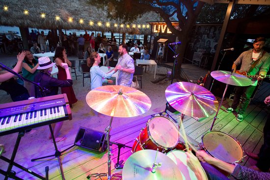 Night live music with people dancing at Tiki Hut