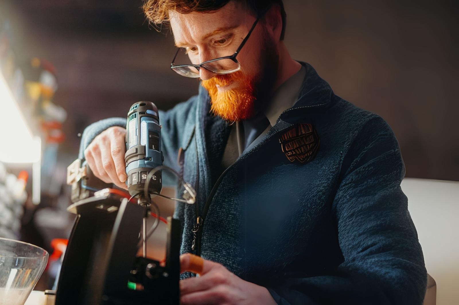 A man assembling Baratza Grinder 