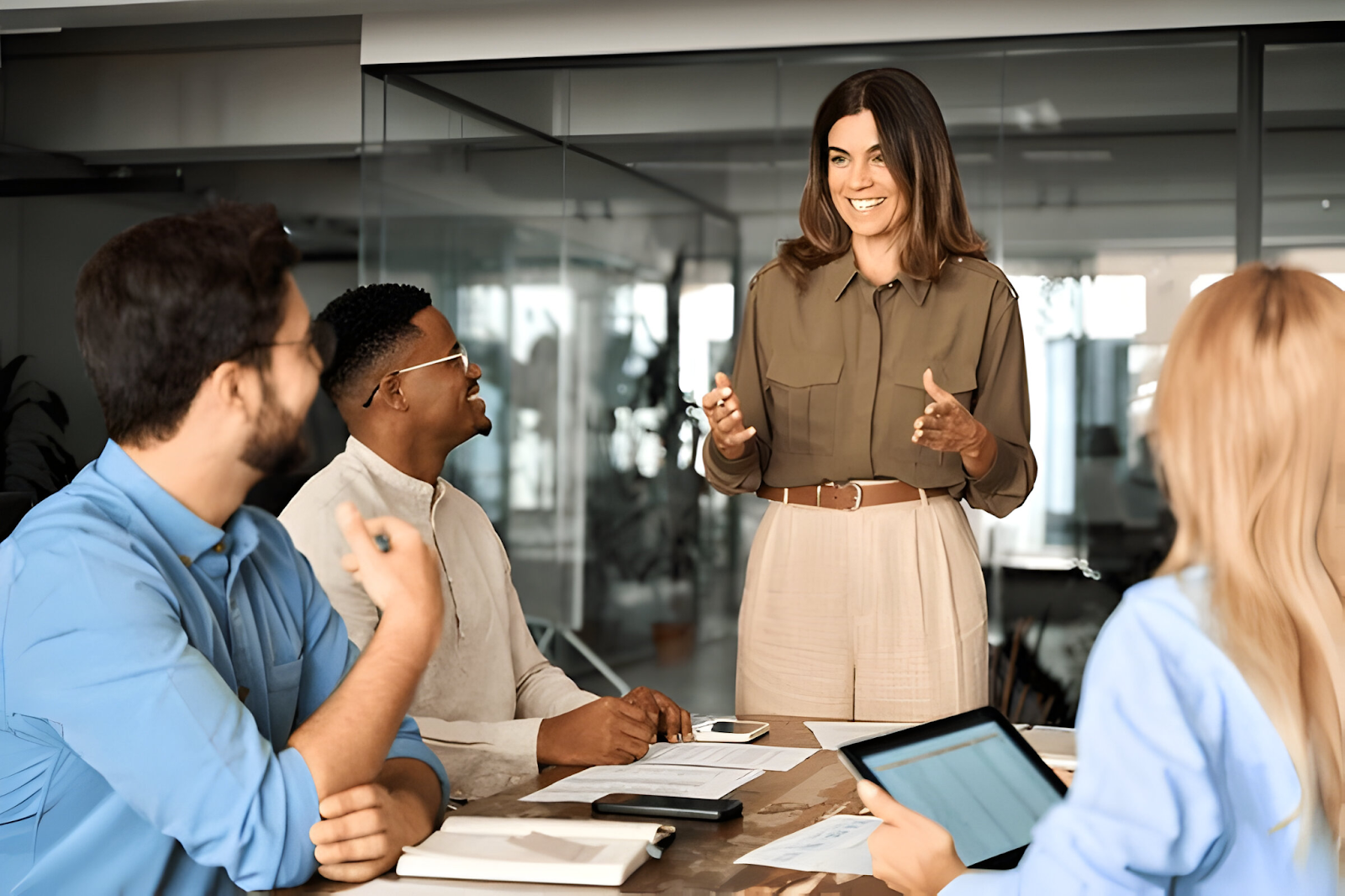 An accountant leading a discussion, ensuring clear communication and transparency in financial matters, crucial for maintaining trust and clarity during a merger.