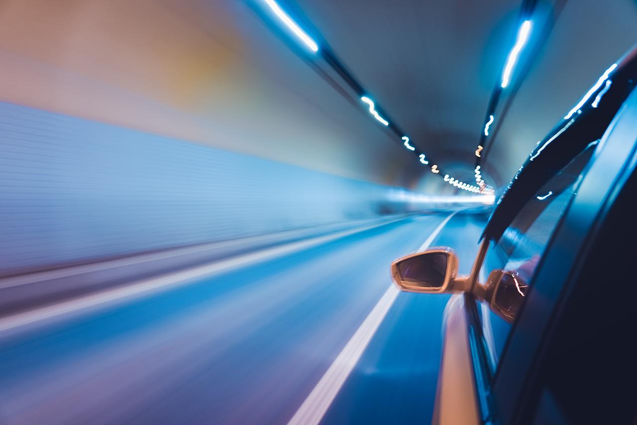 Side view of car with tunnel motion blur