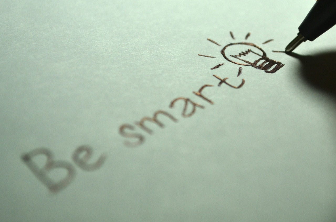 A drawing of a light bulb with the words be smart. White background. 