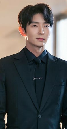 A picture of Lee Joon Gi on a black suit 