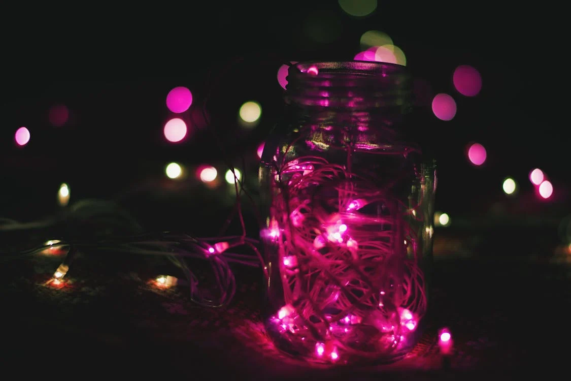 mason jar with pink lights inside