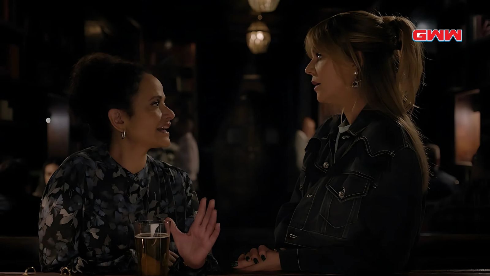 Kaitlin Olson as Morgan Gillory and Judy Reyes as Selena Soto talking in bar in High Potential Season 1