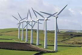 A row of wind turbines in a field

Description automatically generated