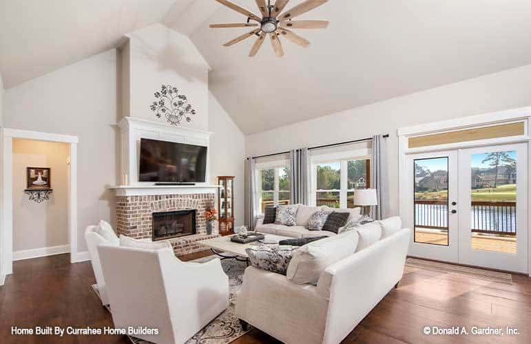 A french door on the side extends the great room onto a covered porch.