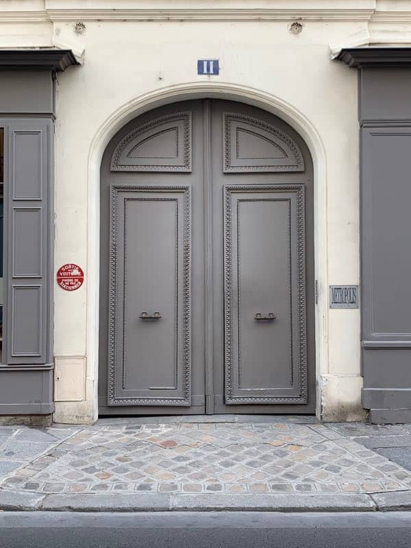 Gray front door painted with Benjamin Moore Sterling Silver 1461