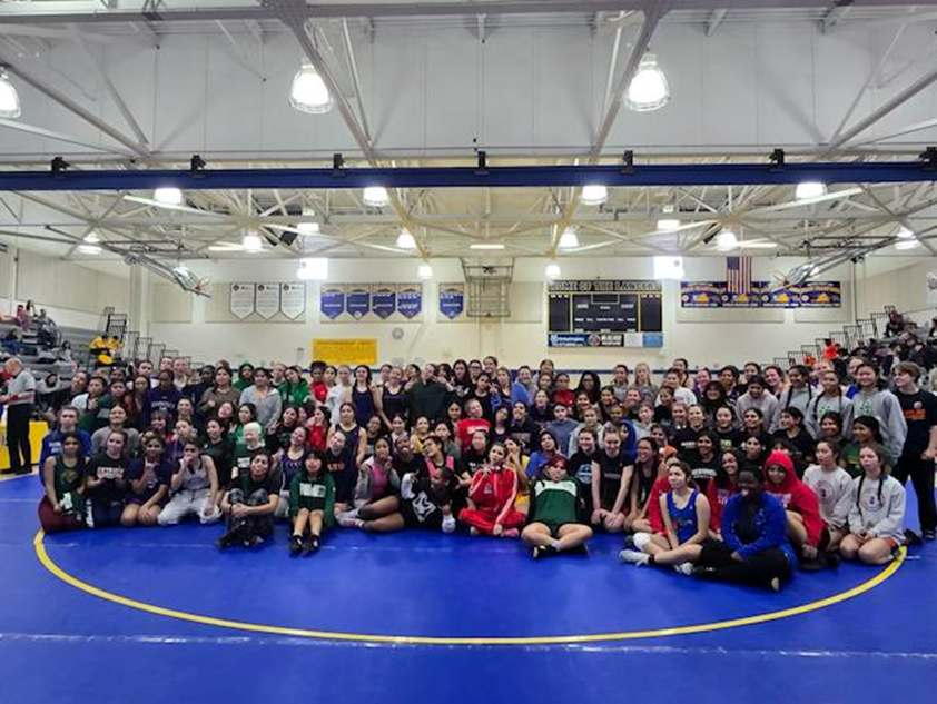 Group shot of female wrestlers at a tournament at Lewis High School. 