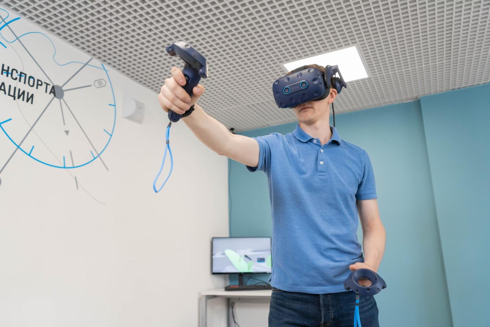 man in blue shirt with VR headset