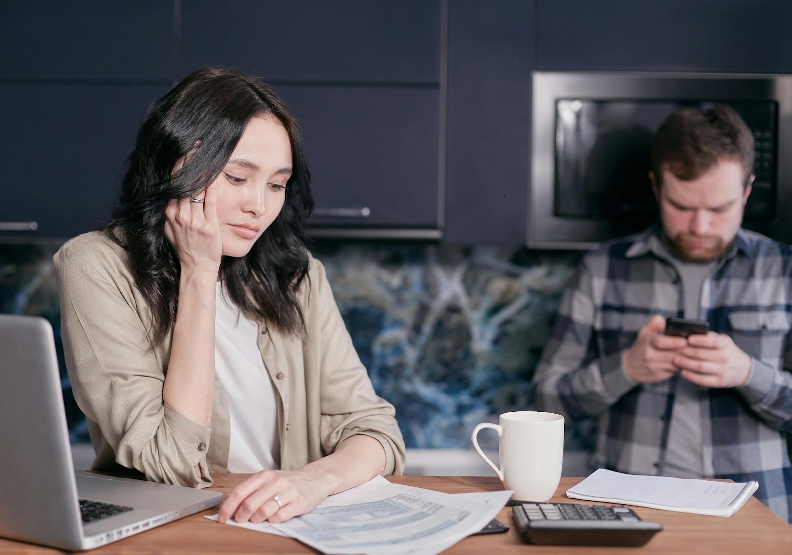 Stressed out couple looking at paperwork