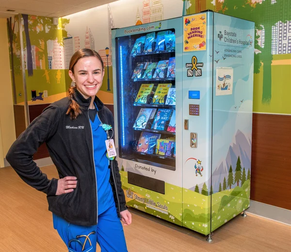 Madison Quinn with Baystate Hospital Book Vending Machine