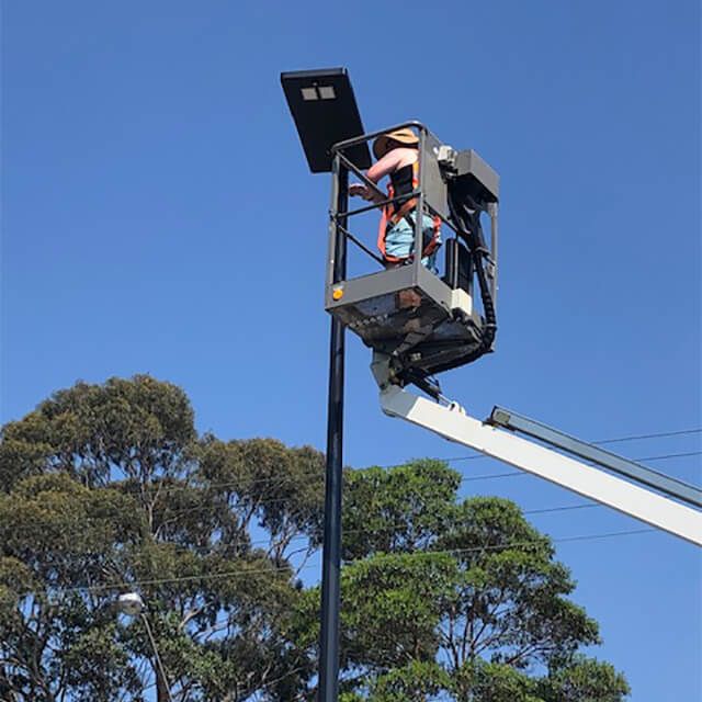 the image displays an installation of solar street light set