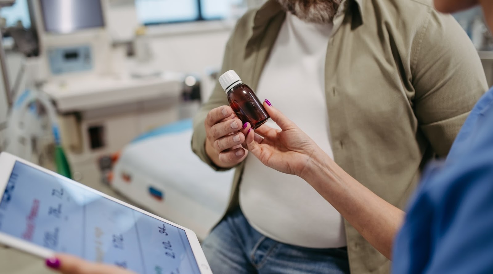 Doctor prescribing medication to lose weight to a patient, giving him a bottle of pills