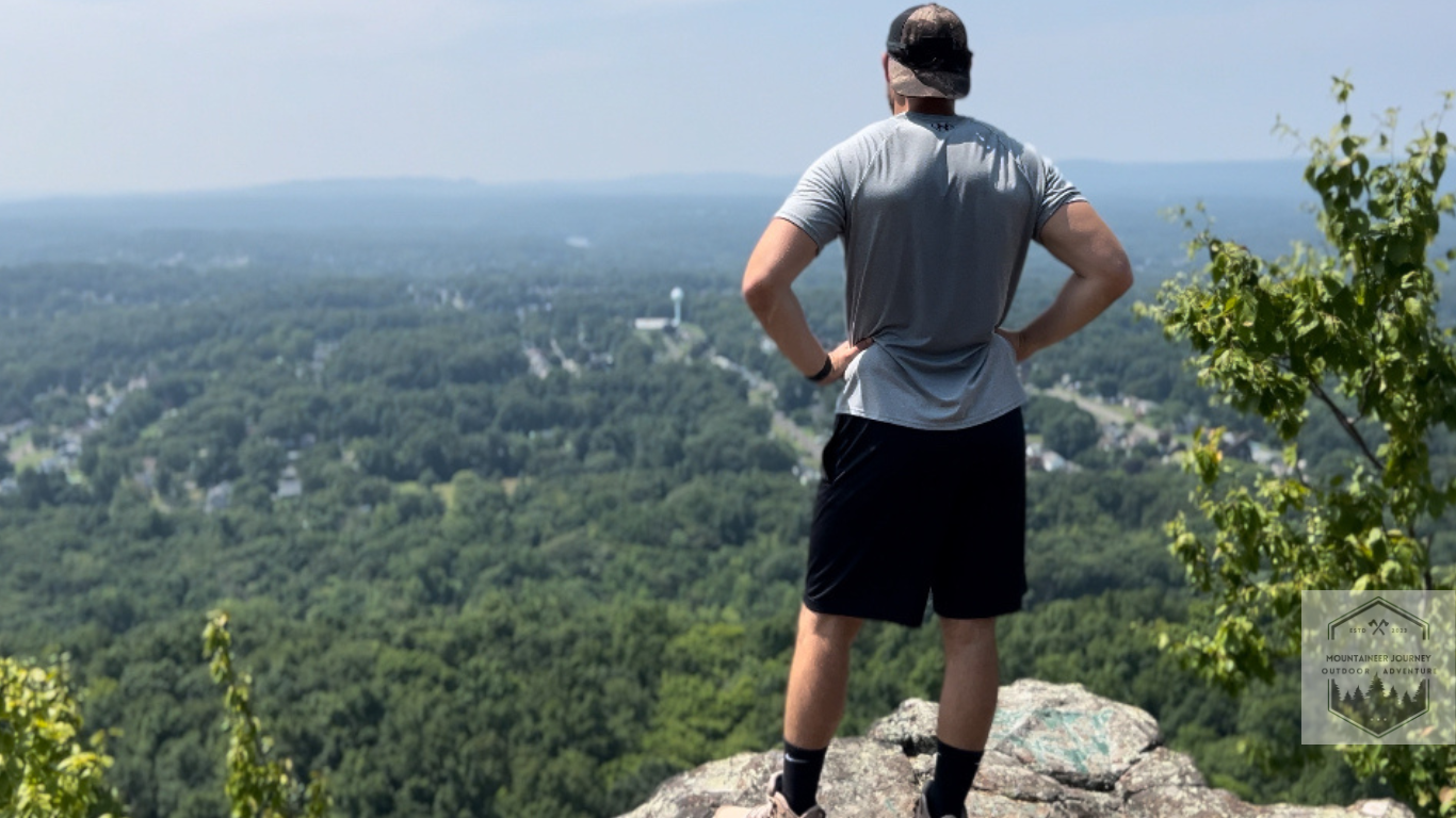 Our Author(Tyler) at the top of the mountain summit after testing hiking boots