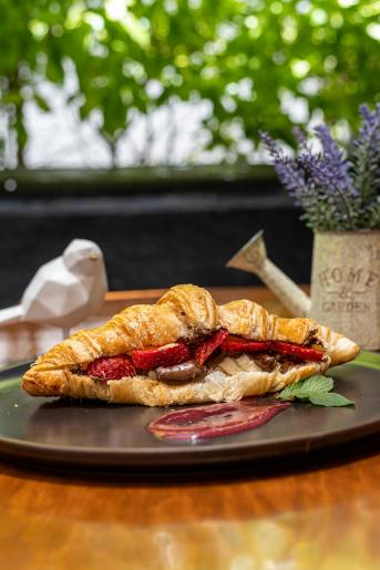 Free Croissant with Nutella and strawberries Stock Photo