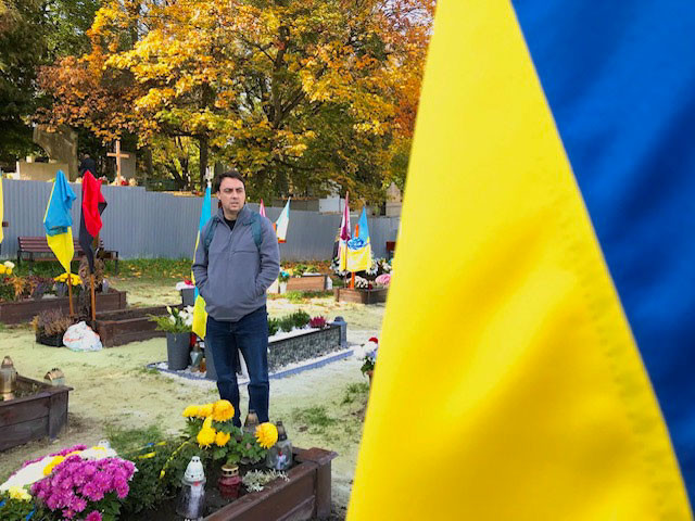 Mike Gallagher stands in a cemetery in Lviv, Ukraine.