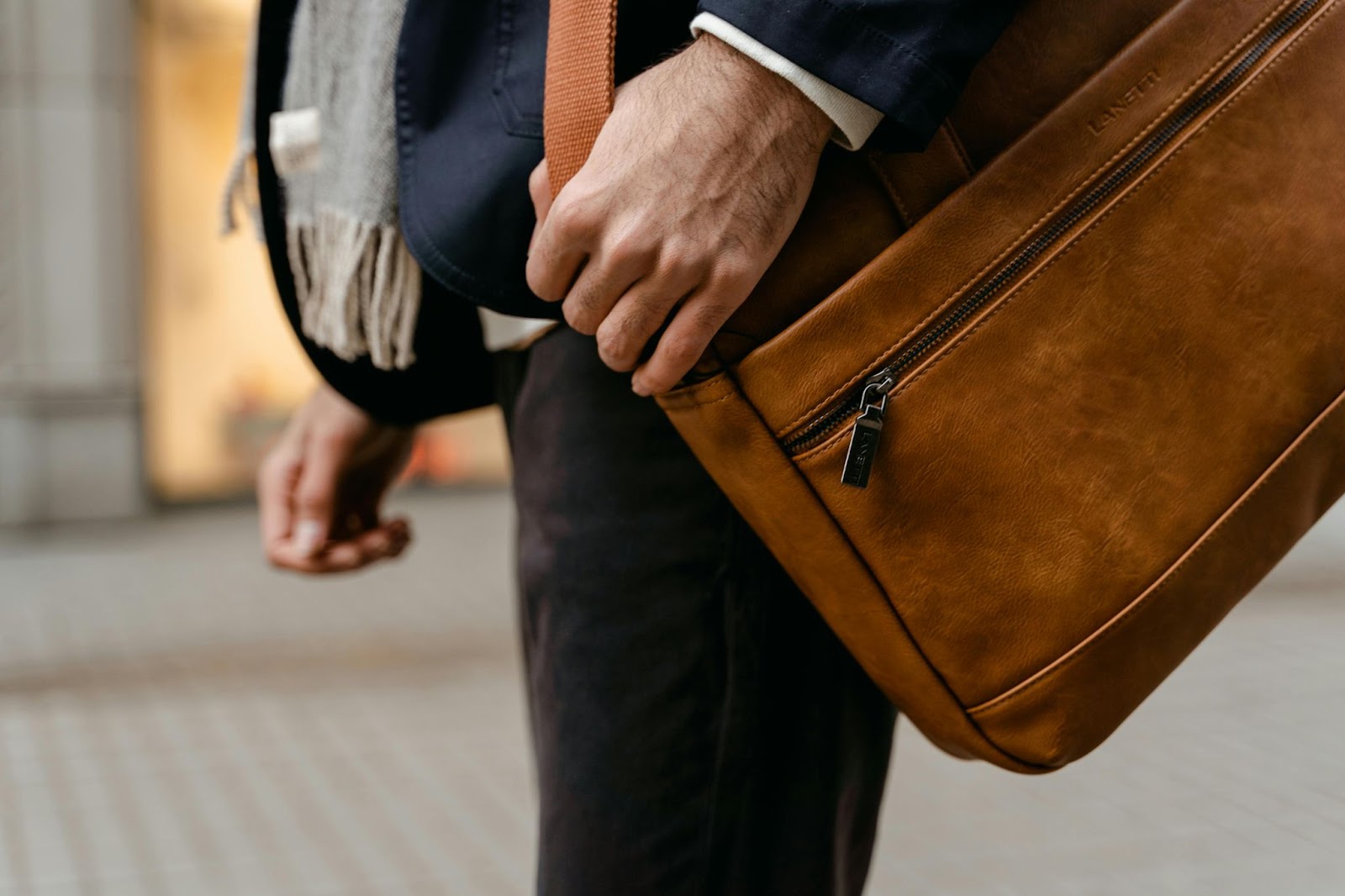 A spacious bag, comfortable shoes and stylish extras like scarves are the finishing touches to business-trip outfits.