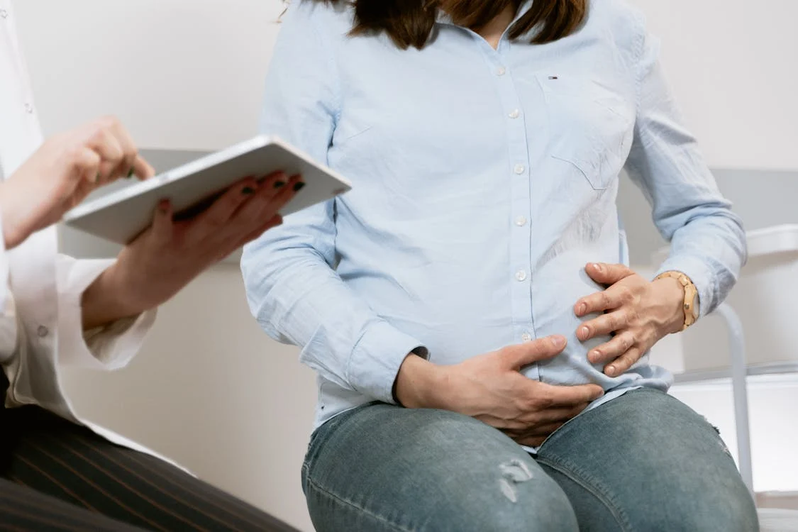 A pregnant person holding her belly

AI-generated content may be incorrect.