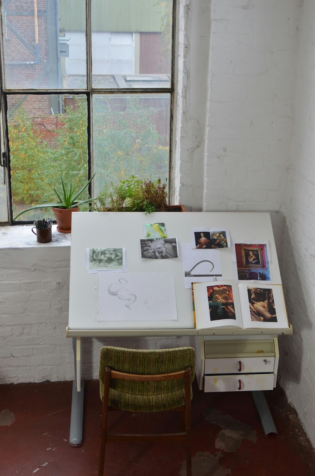 https://www.pexels.com/photo/artist-drawing-table-with-sketches-placed-near-window-6044249/