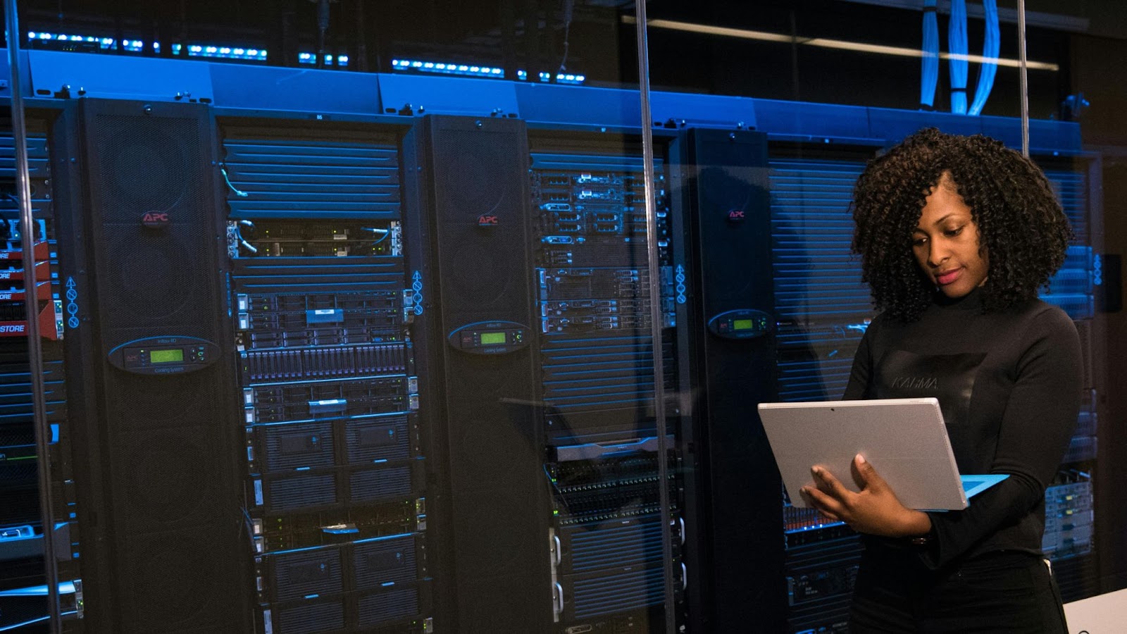 MSSP value proposition explained with visual of cybersecurity engineer working near server racks, symbolizing managed security expertise.