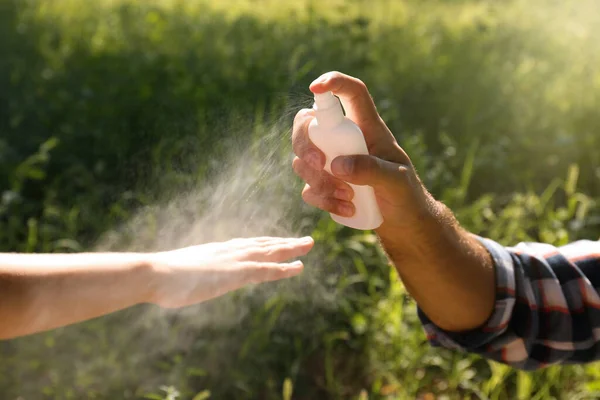 Spraying Natural Insect Repellent