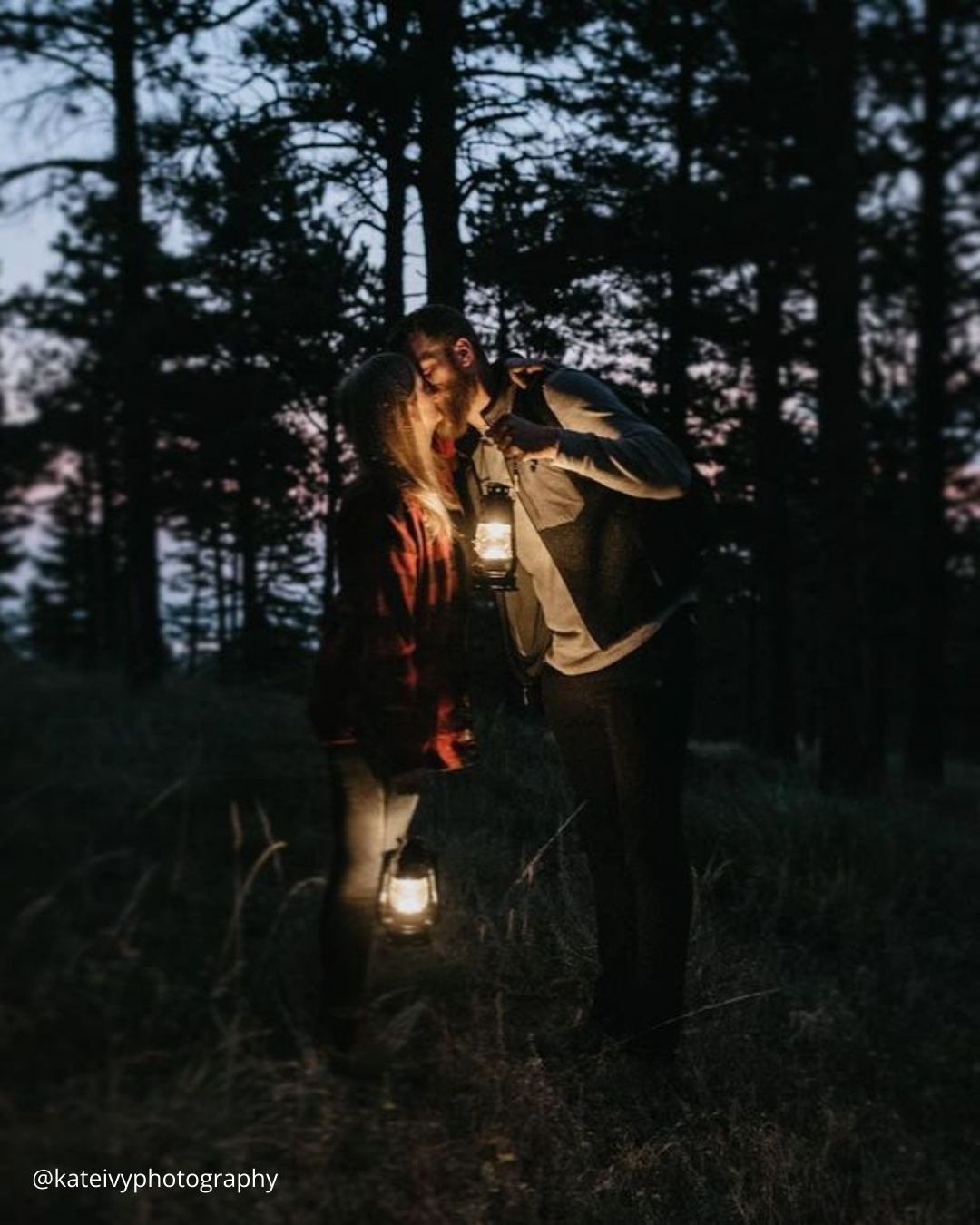 winter engagement photos couple in love holding lantern