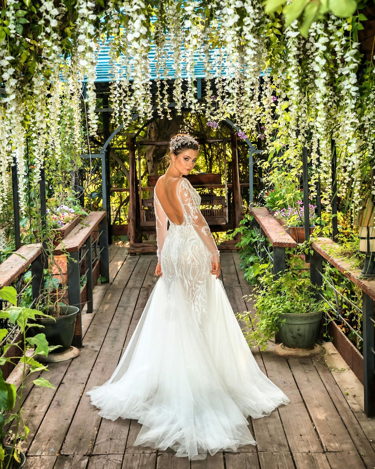 A gorgeous bride standing in a beautiful garden | Source: Pexels