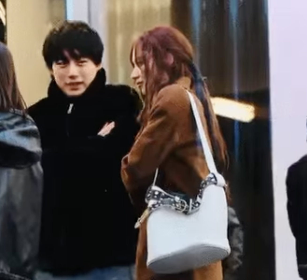 A picture of TWICE Sana and a man in PRADA Men's Fashion Week Fall/Winter 2025