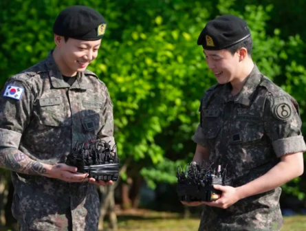 This contains an image of BTS Jimin and Jungkook