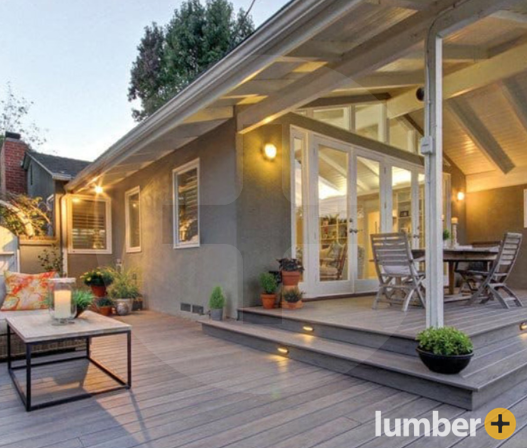 Cozy back patio with a wood deck featuring step lighting for warm ambiance